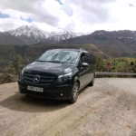 Private vehicle on Atlas Mountains road for 3 valleys day trip from Marrakech — Atlas Wings professional tourist transport