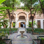 Bahia Palace interior courtyard Marrakech — carved cedar ceiling and zellige tilework on private guided monuments tour Morocco
