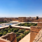 El Badi Palace panoramic terrace with stork nests and medina views — Marrakech imperial palaces tour