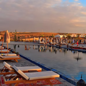 Agafay luxury swimming pool with panoramic desert and Atlas Mountains views — pool and lunch pass from Marrakech Morocco