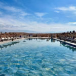 Luxury pool in Agafay Desert with High Atlas Mountains panorama — pool and lunch pass 30€ per person from Marrakech Morocco
