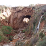 Iminifri Natural Bridge Middle Atlas Morocco — stone karst arch over river gorge on private day trip from Marrakech